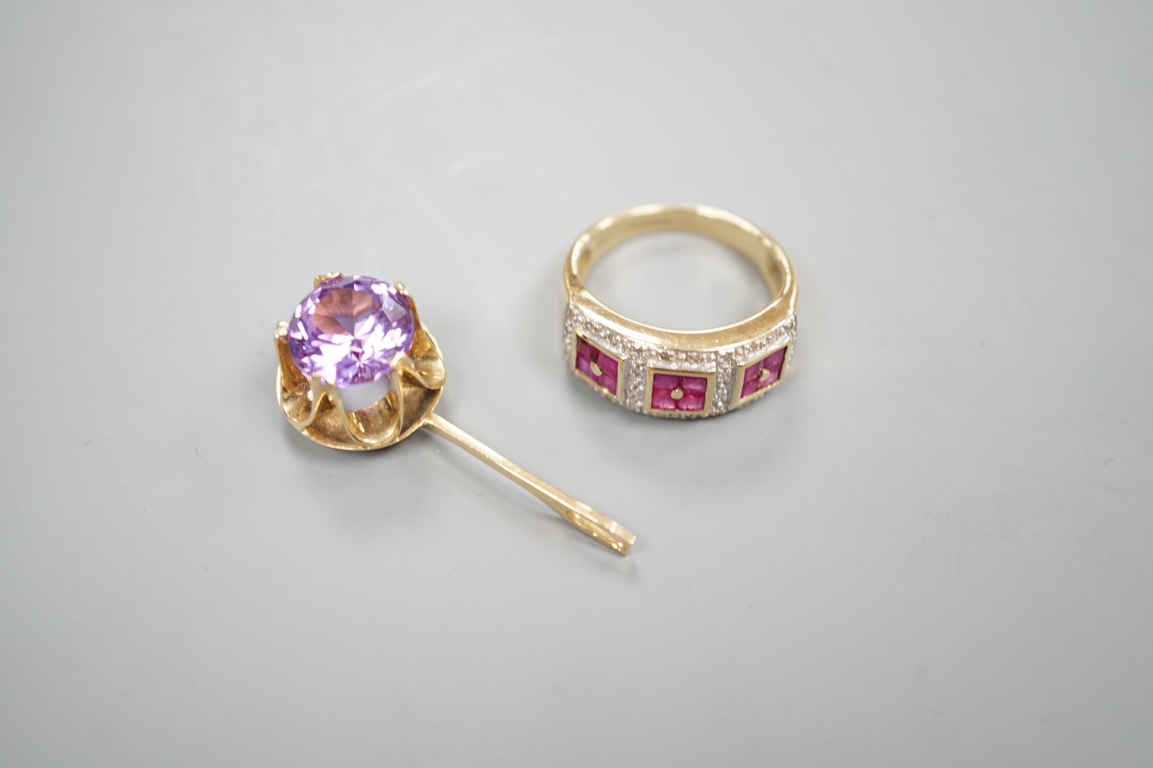 A modern 9ct gold, ruby and diamond cluster ring and a modern yellow metal and gem set pendant, gross 7.8 grams.